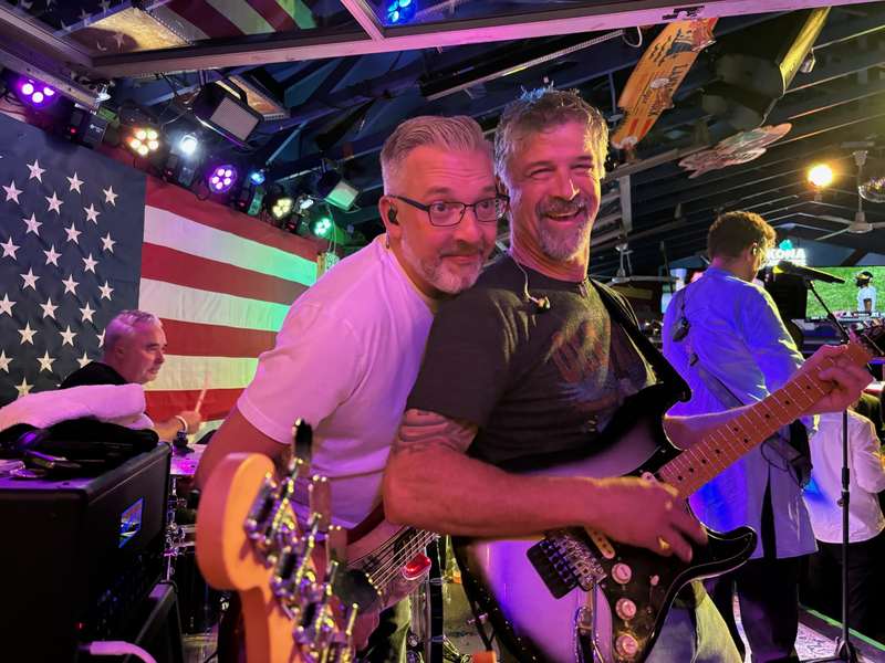 Tony keeping the beat while Bill and Joe share a laugh onstage