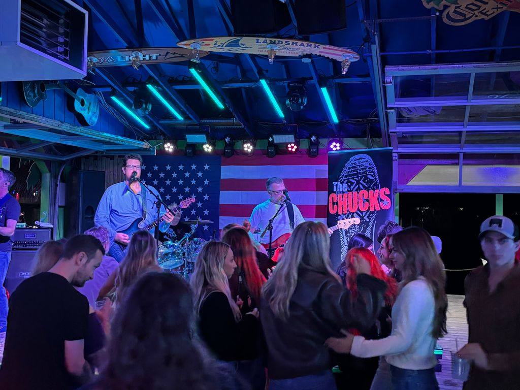 The current Chucks lineup playing to a packed room beneath blue stage lights
