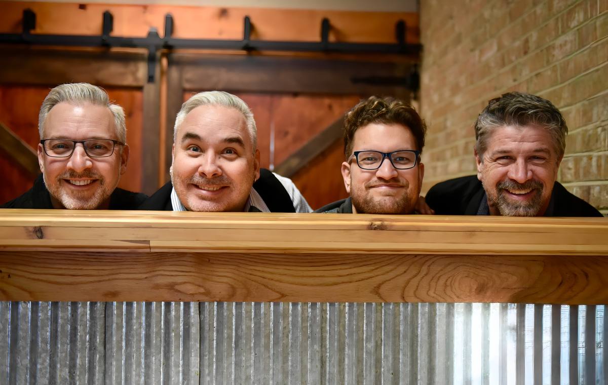 The current Chucks lineup sharing a playful moment behind the bar