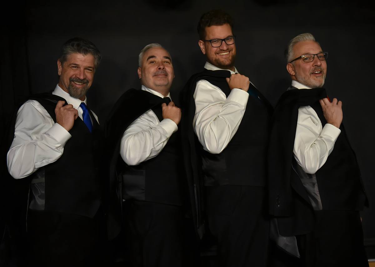Neel, Joe, Bill, and Tony bringing their onstage humor to a band portrait